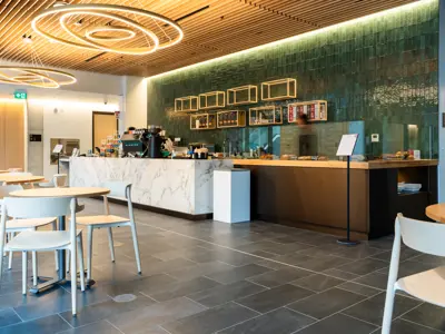 Inside of a Cafe with a green wall