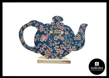 Blue teapot with flower designs