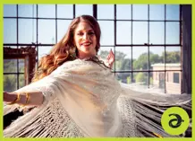 Woman dancing, with many windows behind her