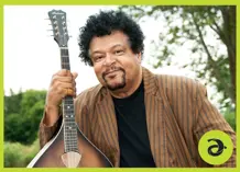 Harrison Kennedy holding a guitar