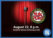 Image of a microphone on a stage that says "Yuk Yuks August 23"