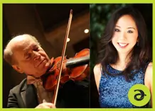 Moshe holding a violin and Angela smiling