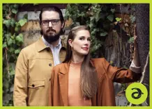 James Hill & Anne Janelle in front of a background of greenery